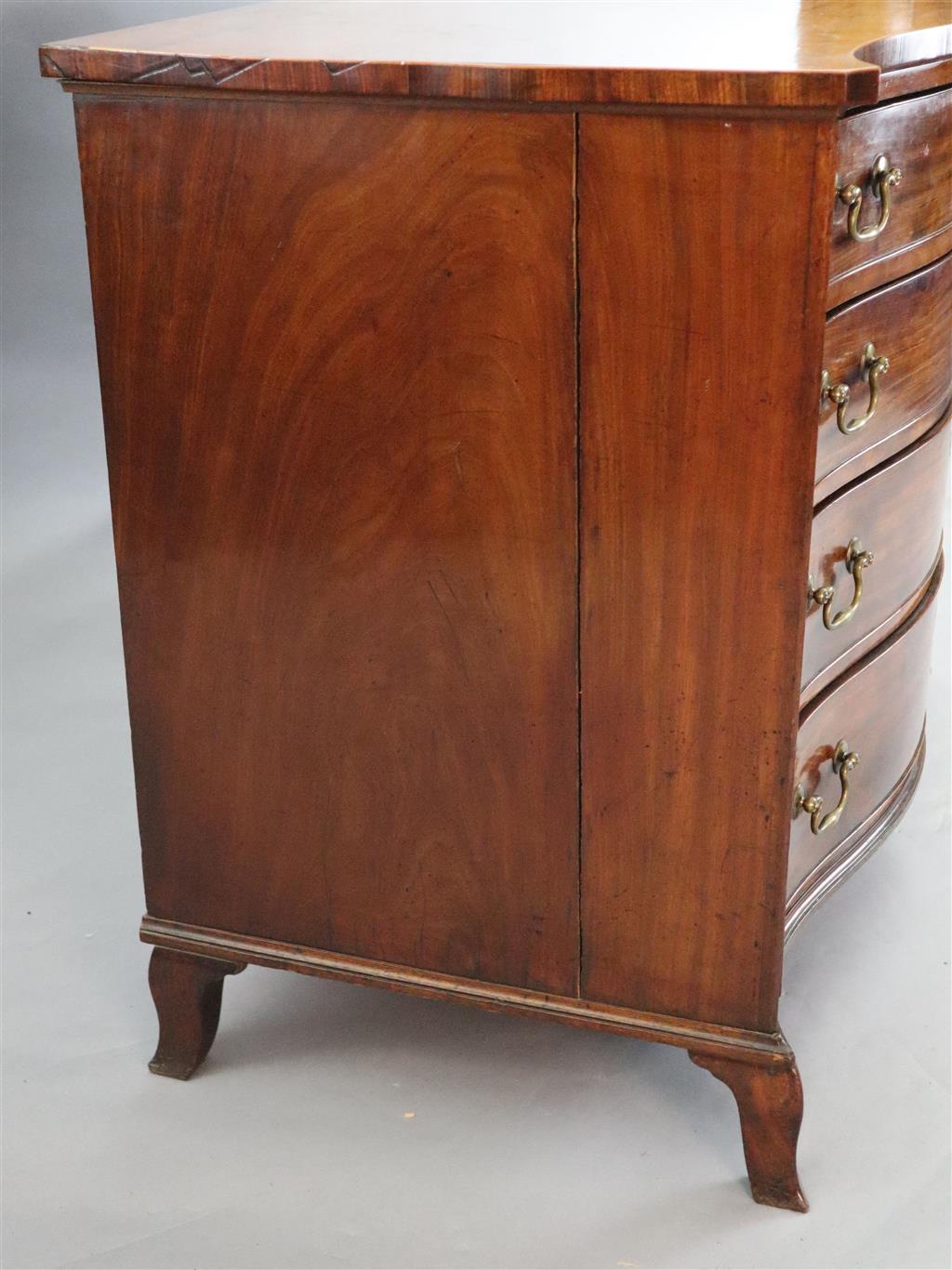 A George III serpentine mahogany dressing chest, W.3ft 6in. D.2ft 1in. H.2ft 10in.